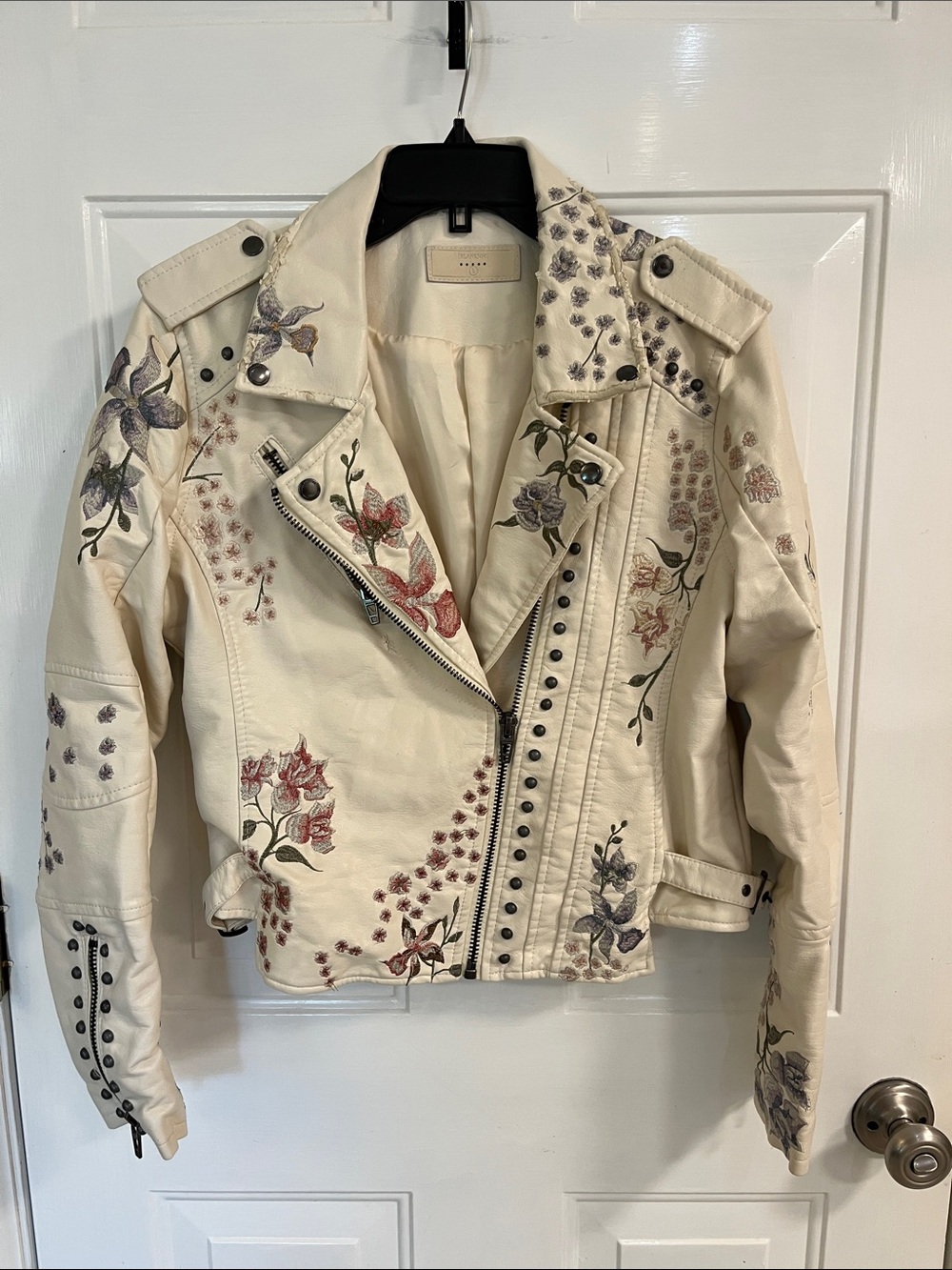 BLANKNYC jacket. White. Floral embroidery with studs and zippers. Size large.